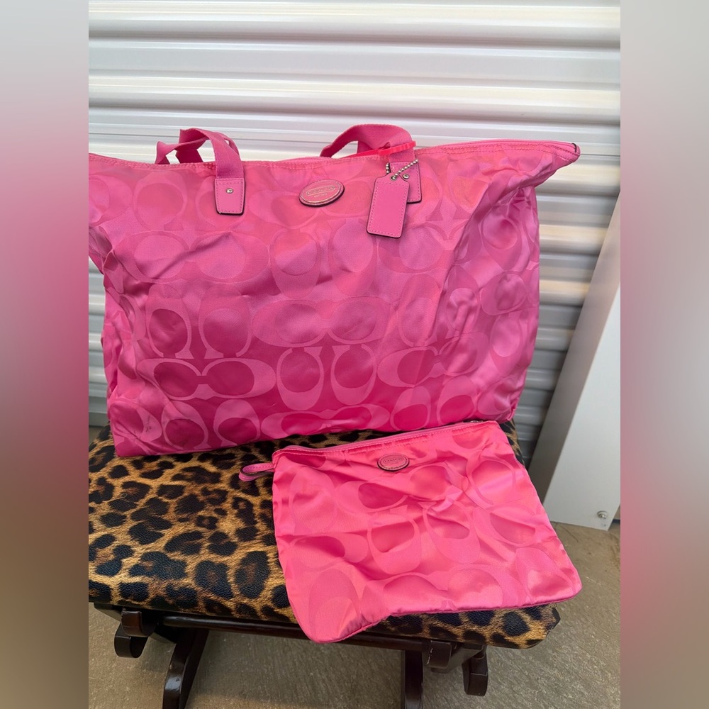 Pink Coach nylon weekender bag and a pouch
